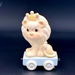 Precious Moments Ceramic Lion on Wheels Figurine - Royal Cuteness Alert!